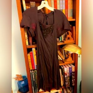 Vintage little black dress. Size 7. Rhinestone and open back with tie. Form fit